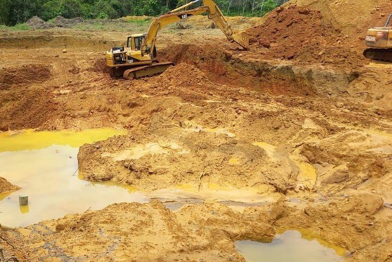 Heavy machinery - excavators and loaders used in modern gem mining